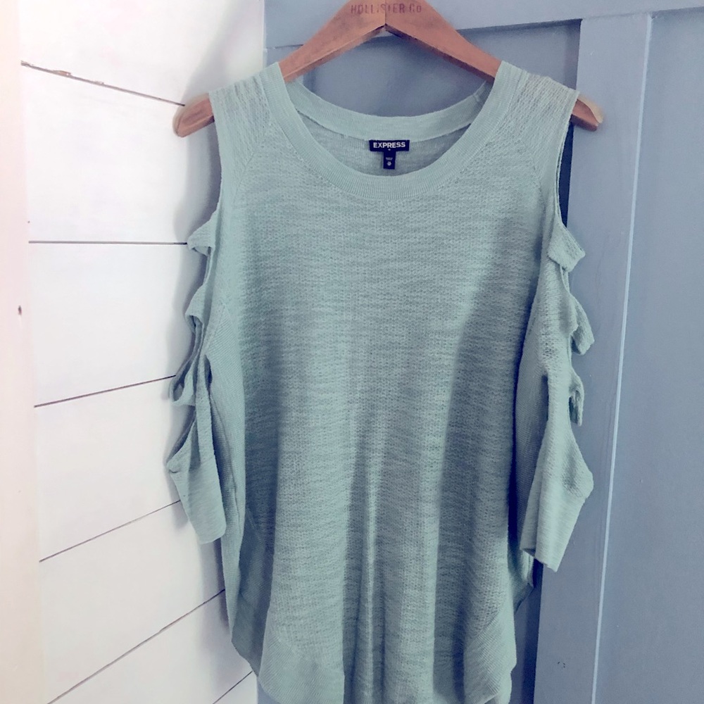 Express quarter length shirt with cuts on sleeves.